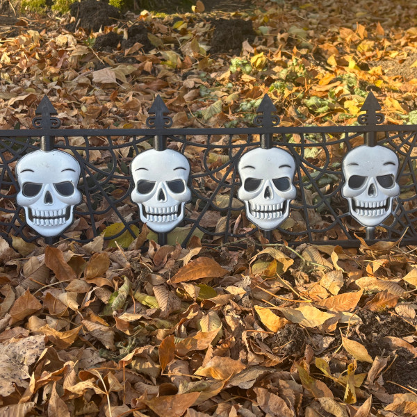 Boo at the 2025 A row of skelaton decorations